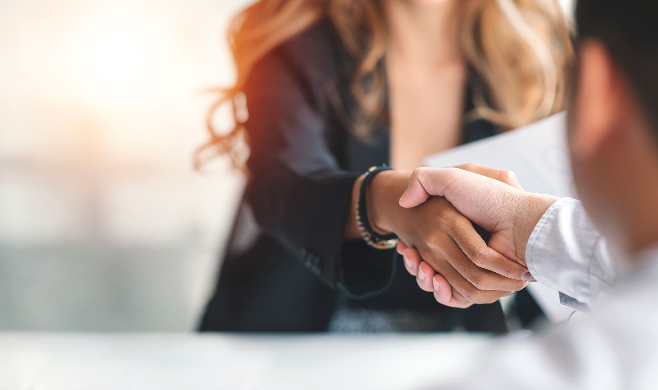 shaking hands business partners