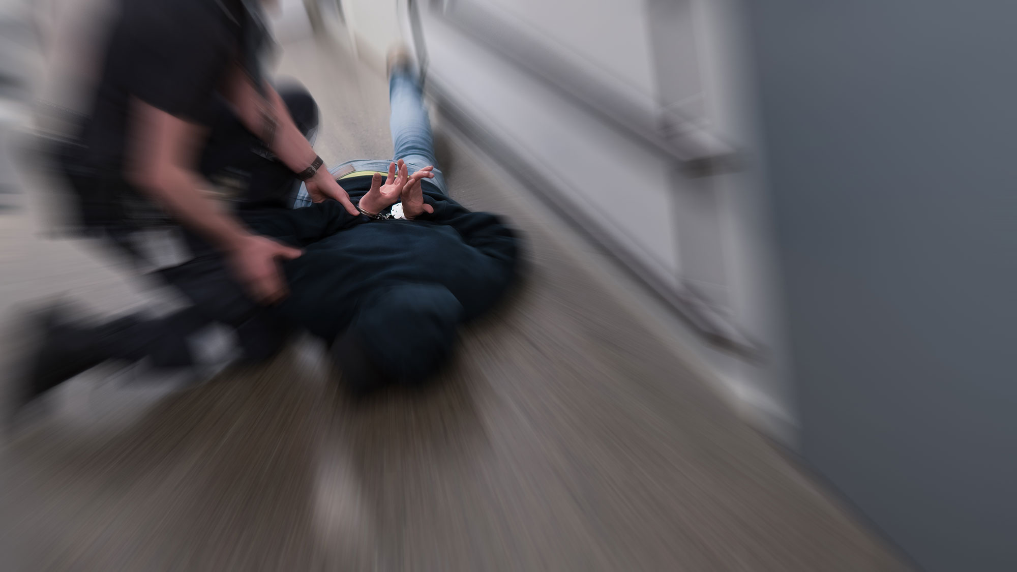 Guard pinning down suspect
